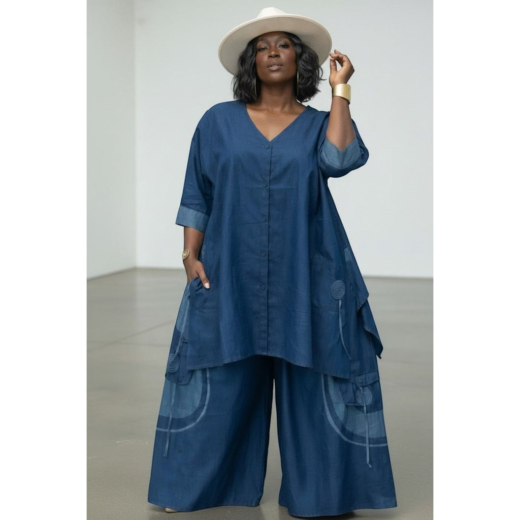 Unspoken Couture Boutique indigo denim tunic top and wide-leg pants set with contrast print details and side pockets.